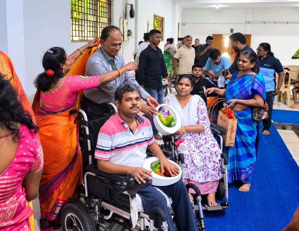 Guests presenting floral gifts to members at the hydrotherapy camp
