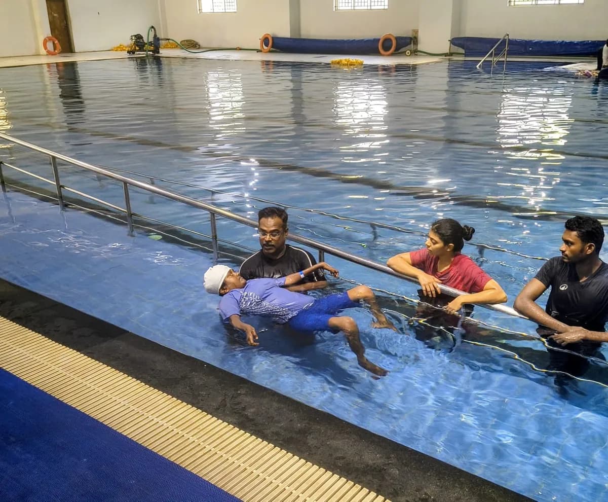 A member supported in the water during a TNMDA hydrotherapy session