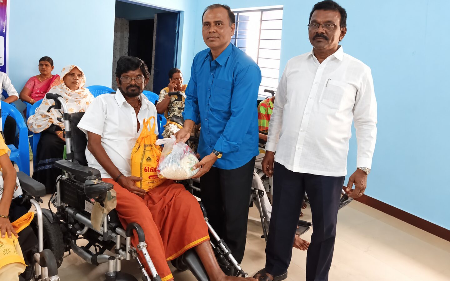 Members and volunteers gathered during a TNMDA distribution event